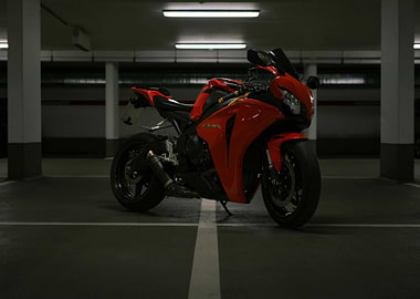 Red CBR Motorcycle in Parking Garage