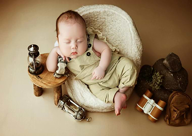 Sleeping Baby Adventurer with Camping Gear