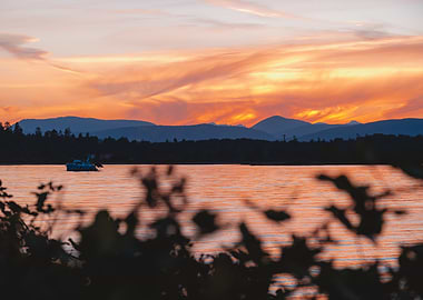 Sunset over lake with boat