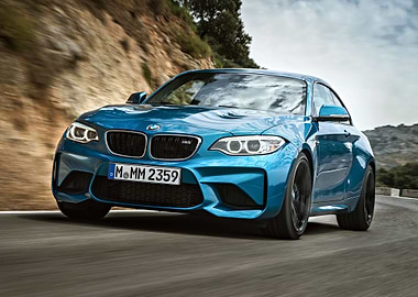 Blue BMW M2 on Mountain Road