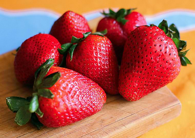 Fresh Strawberries on Wooden Cutting Board