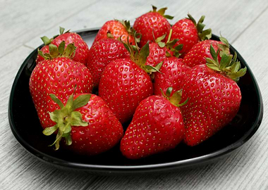Fresh Strawberries on a Black Plate