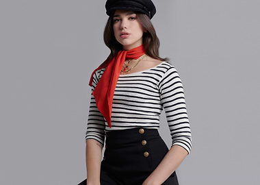 Dua Lipa in striped shirt and hat