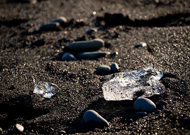 Ice and Stones on Black Sand
