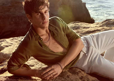 Shawn Mendes Lying on Rocks