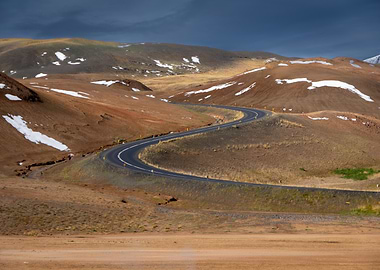 Winding Road Through Hilly Landscape
