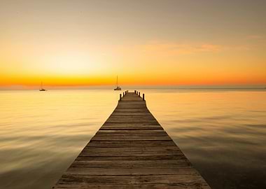 Dock at Sunset with Sailboats