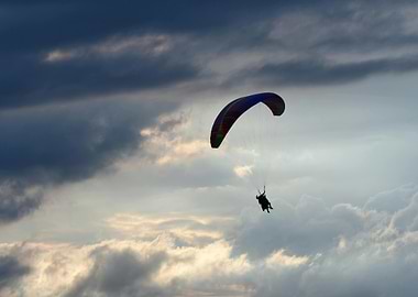 Paragliding adventure in cloudy sky