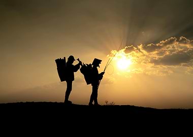 Silhouette of fishermen at sunset