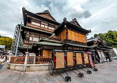 Traditional Japanese Building with Rickshaws