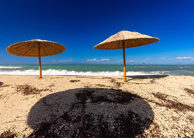Beach Umbrellas on Sandy Shoreline, Greece