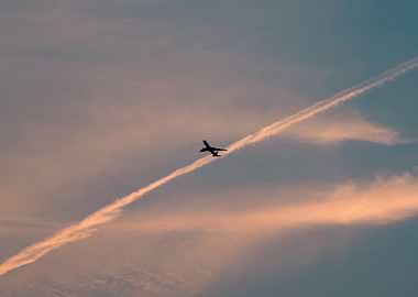 Airplane flying through the sky