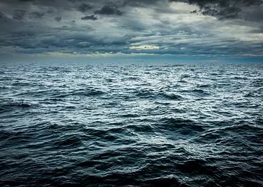 Dark Ocean Under Cloudy Sky