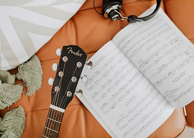 Guitar, Music Book, and Headphones