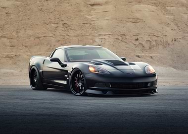 Black Corvette in Desert Landscape