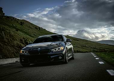Black BMW on Mountain Road