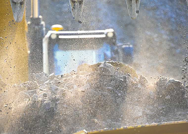 Excavator Digging Soil and Rocks