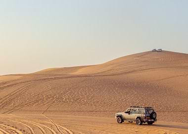 Desert landscape with off-road vehicles