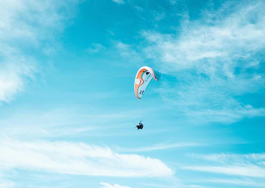 Paragliding in a blue sky