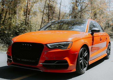 Orange Audi Quattro on Road