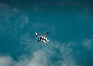 Seaplane in flight against blue sky