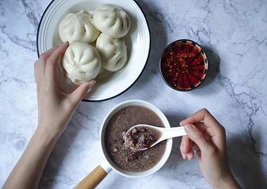 Asian breakfast with buns and porridge