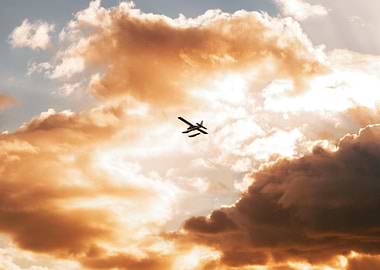 Airplane flying through orange clouds
