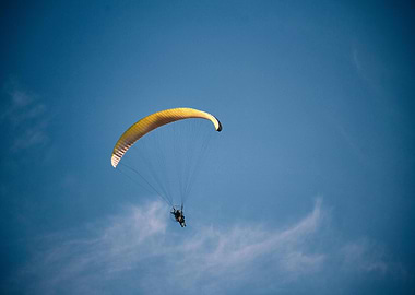 Paragliding in a Clear Blue Sky