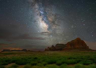 Milky Way over a grassy landscape