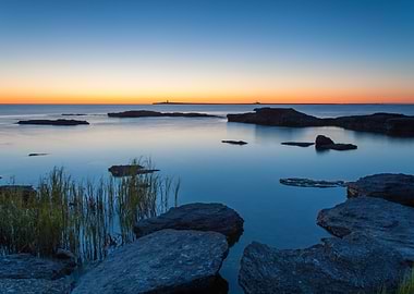 Calm Ocean at Sunset with Rocks
