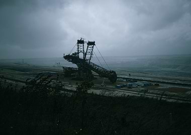 Gloomy Industrial Landscape with Excavator