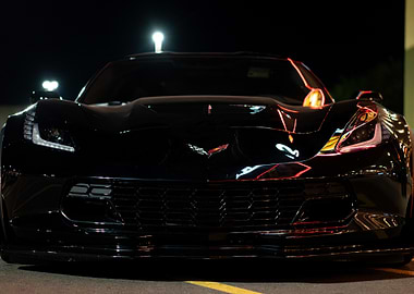 Black C7 z06 Corvette Front View at Night