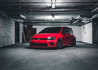 Red Volkswagen Golf R in Garage