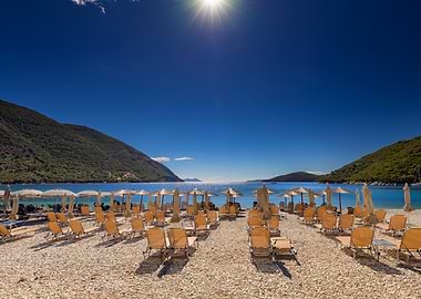 Beach chairs and umbrellas on coastline, Leukada