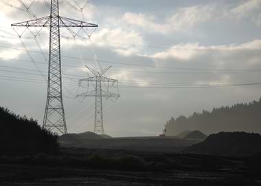 Power Lines in a Misty Landscape