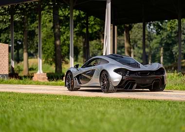 Silver McLaren P1 on Green Lawn
