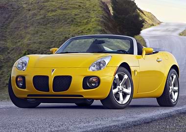 Yellow Pontiac Solstice Convertible on Road