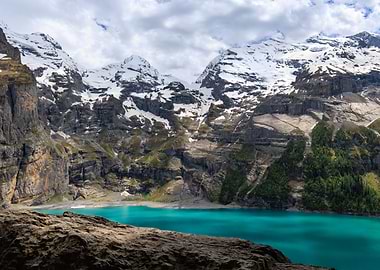 Turquoise Lake Surrounded by Snowy Mountains