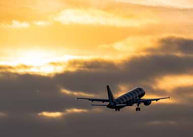 Airbus A320neo Condor taking off at sunset
