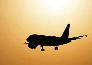 A320 Silhouette Against Golden Sky