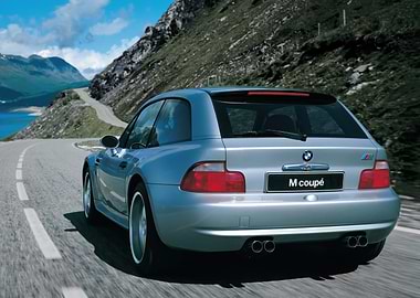 Silver BMW M Coupe on Mountain Road