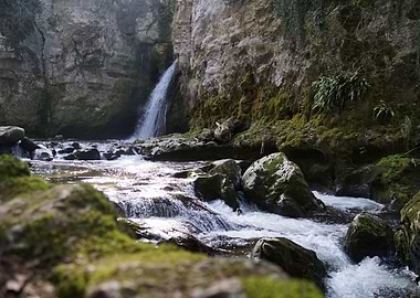 Waterfall and Stream in Rocky Landscape