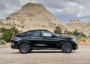 Black BMW X6 in Desert Landscape