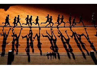 Runners' Silhouettes and Shadows on Track