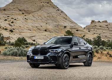 Black BMW X6 M Competition in desert