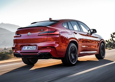 Red BMW X4 M speeding on road