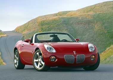 Red Pontiac Solstice Convertible on Road