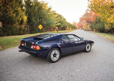 Blue BMW M1 on Road