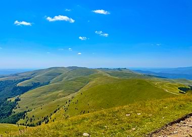 Green Hills Under Blue Sky