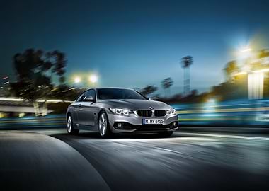 Silver BMW on the Road at Night